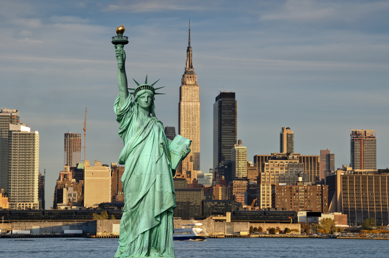 new york cityscape skyline empire state building and statue of liberty